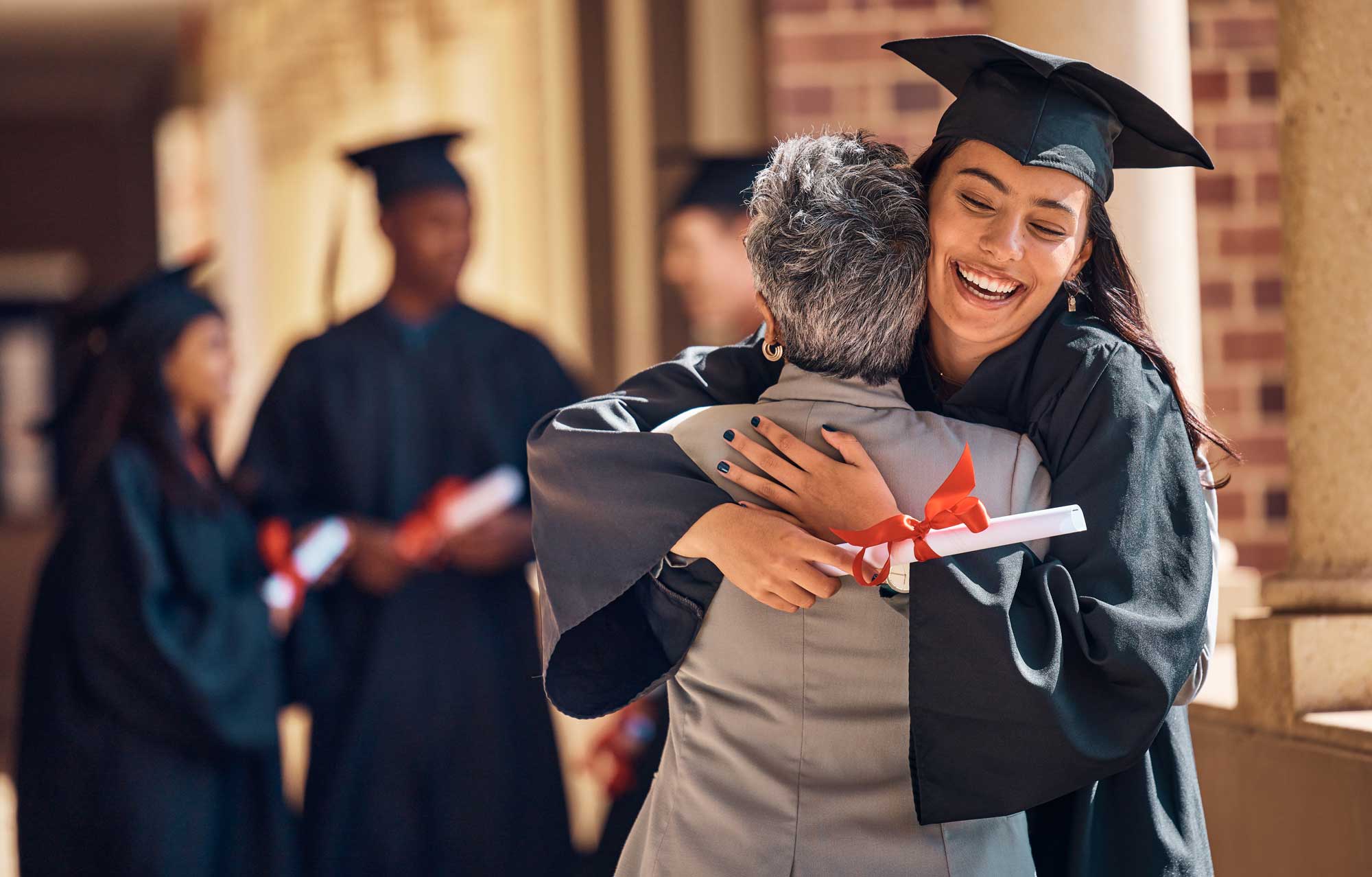 hug-graduation-and-graduate-women-and-education-achievement-success-on-university-campus-and-certificate-with-academic-goals-reached